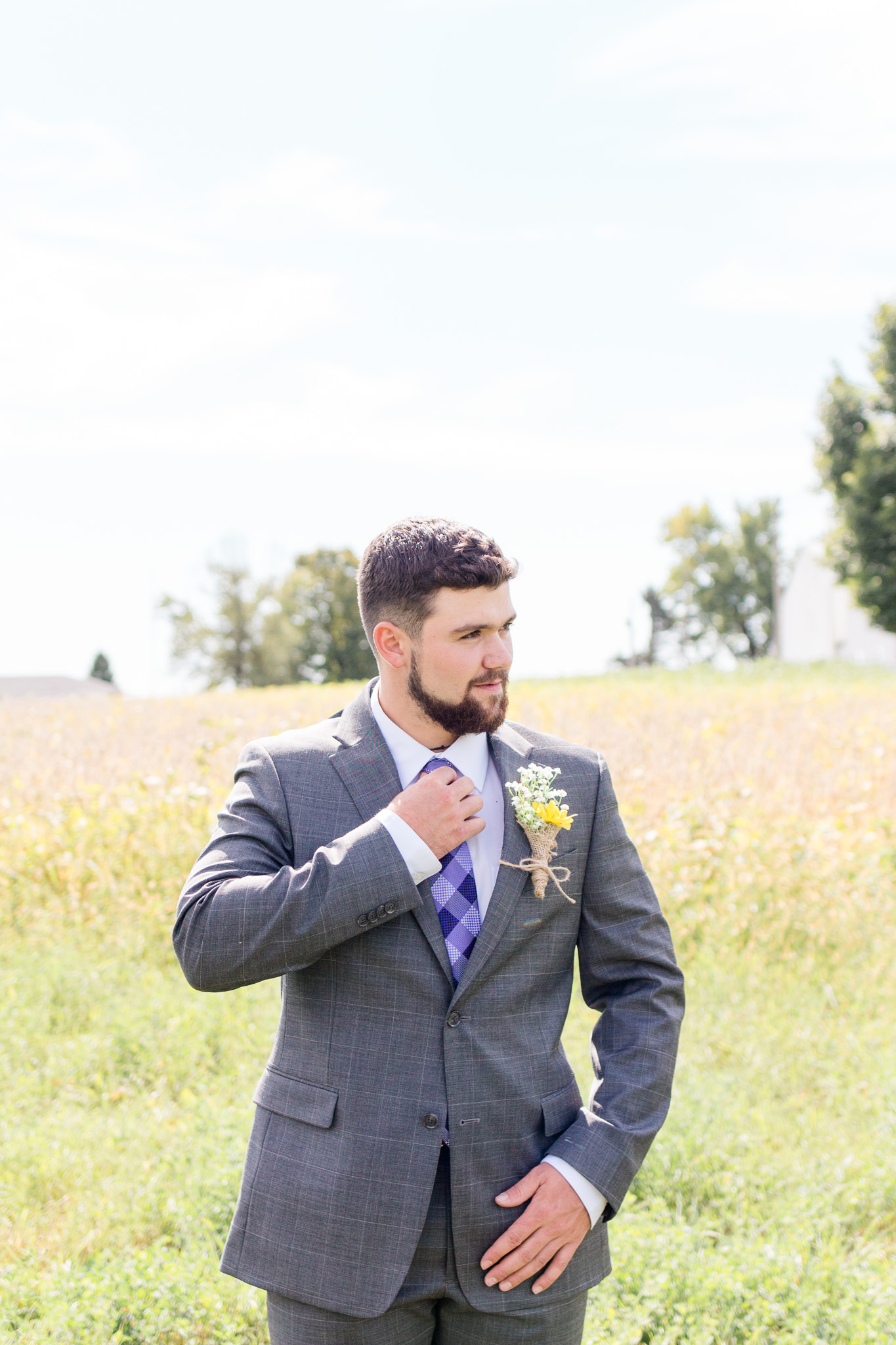 Grooms gray suit with purple plaid tie